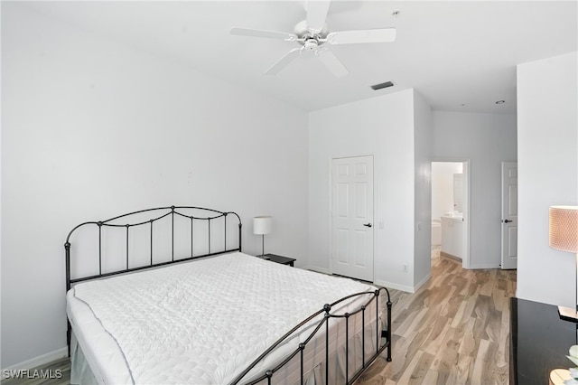 1000 L Ambiance Cir Unit 205, Naples, FL 34108 - bedroom with light wood finished floors and ceiling fan