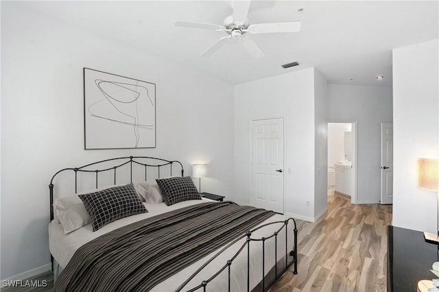 1000 L Ambiance Cir Unit 205, Naples, FL 34108 - bedroom featuring light wood-style flooring and ceiling fan