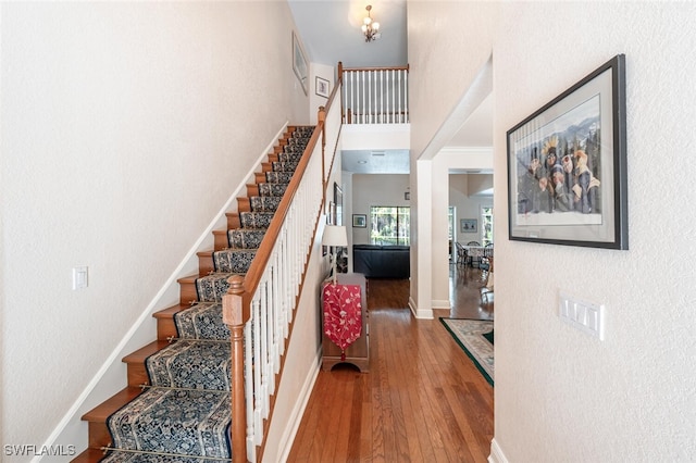 13915 Collier Blvd, Naples, FL 34119 - stairs featuring hardwood / wood-style floors and baseboards