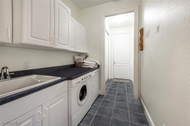 13915 Collier Blvd, Naples, FL 34119 - laundry room featuring dark tile patterned floors and cabinet space