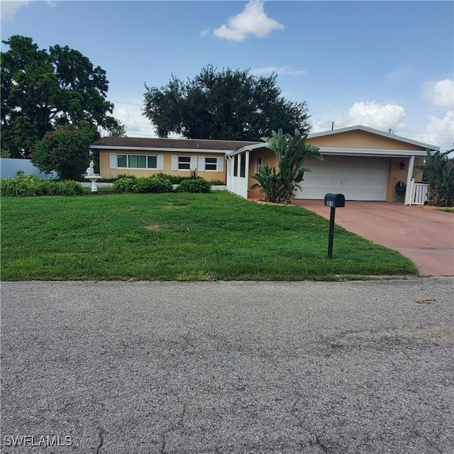 1101 E Jasmine Rd, Lehigh Acres, FL 33936 - single story home featuring driveway, a front yard, and an attached garage