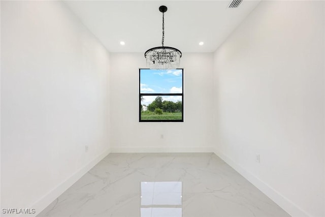 147 Partridge St, Lehigh Acres, FL 33974 - spare room featuring a chandelier, light marble finish flooring, and recessed lighting