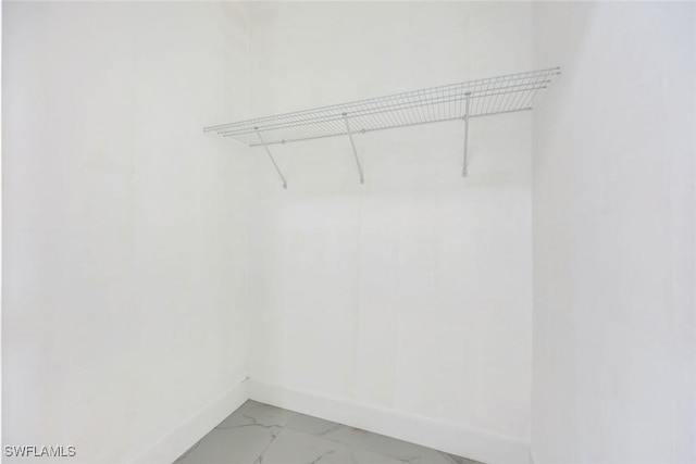 147 Partridge St, Lehigh Acres, FL 33974 - spacious closet featuring light marble finish floors