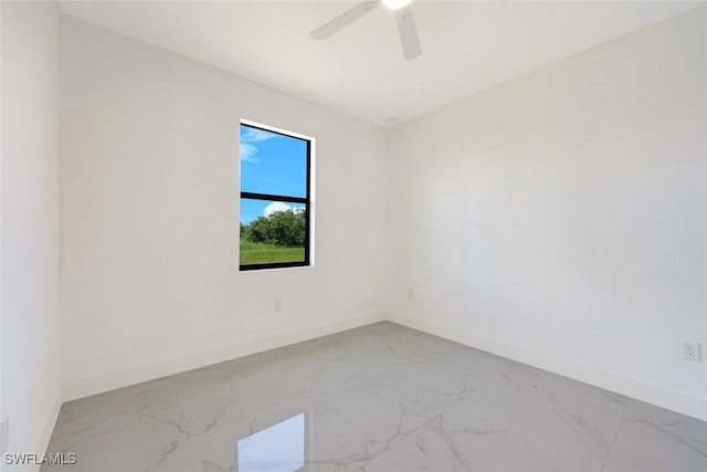 147 Partridge St, Lehigh Acres, FL 33974 - spare room with marble finish flooring and a ceiling fan