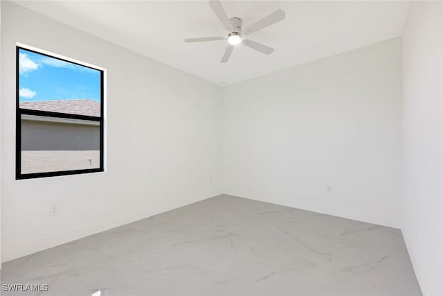147 Partridge St, Lehigh Acres, FL 33974 - spare room with marble finish floors and ceiling fan