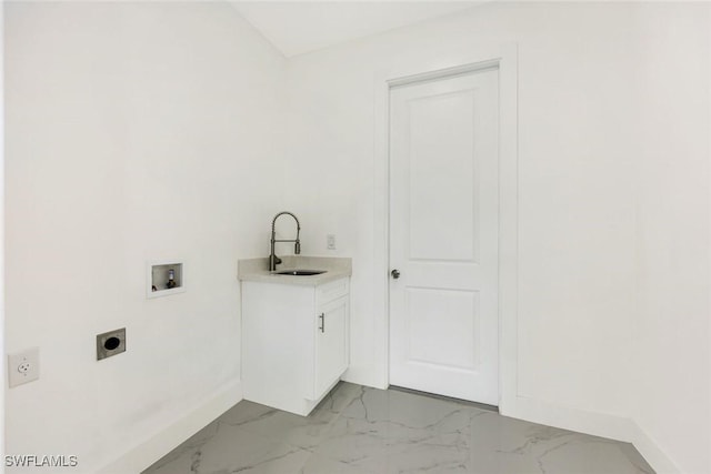 147 Partridge St, Lehigh Acres, FL 33974 - laundry area featuring hookup for an electric dryer, washer hookup, cabinet space, and light marble finish floors