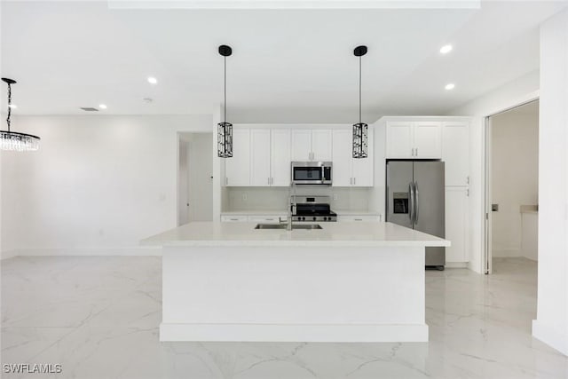 147 Partridge St, Lehigh Acres, FL 33974 - kitchen with stainless steel appliances, light marble finish flooring, an island with sink, light countertops, and recessed lighting