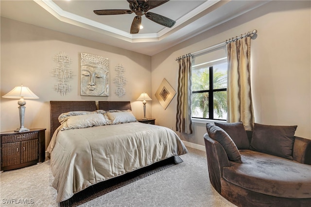 7478 Winding Cypress Dr, Naples, FL 34114 - carpeted bedroom featuring a tray ceiling and ceiling fan