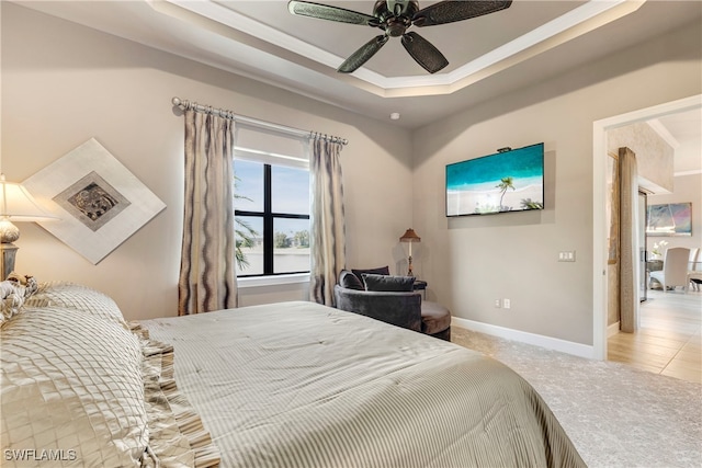 7478 Winding Cypress Dr, Naples, FL 34114 - carpeted bedroom with a raised ceiling and ceiling fan