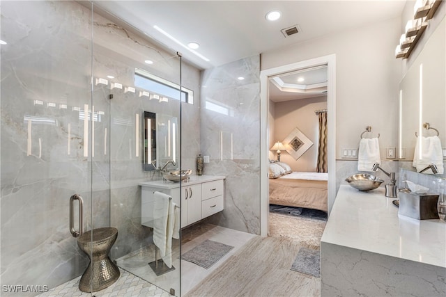 7478 Winding Cypress Dr, Naples, FL 34114 - bathroom with vanity, a marble finish shower, ensuite bath, and recessed lighting