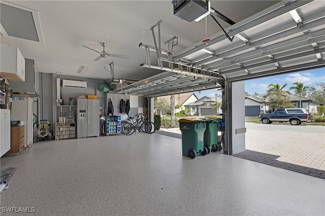 7478 Winding Cypress Dr, Naples, FL 34114 - garage featuring stainless steel fridge with ice dispenser, an AC wall unit, a garage door opener, and ceiling fan