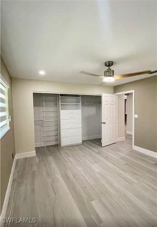 1407 Alwynne Dr, Lehigh Acres, FL 33936 - unfurnished bedroom featuring wood finished floors, a closet, recessed lighting, and ceiling fan