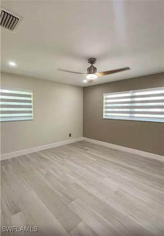 1407 Alwynne Dr, Lehigh Acres, FL 33936 - unfurnished room featuring ceiling fan and wood finished floors