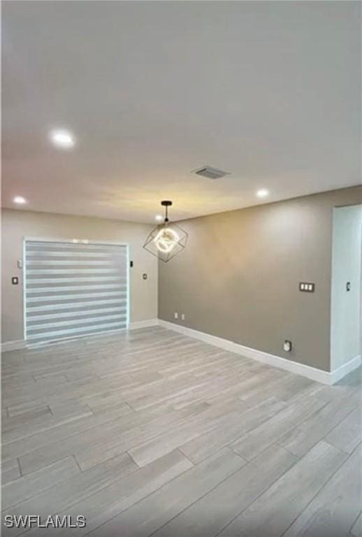 1407 Alwynne Dr, Lehigh Acres, FL 33936 - empty room with recessed lighting and wood finish floors