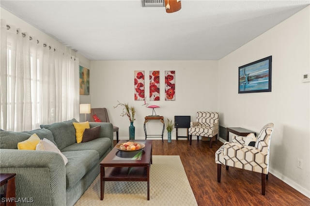 326 Canyon Dr N, Lehigh Acres, FL 33936 - living area featuring baseboards and wood finished floors