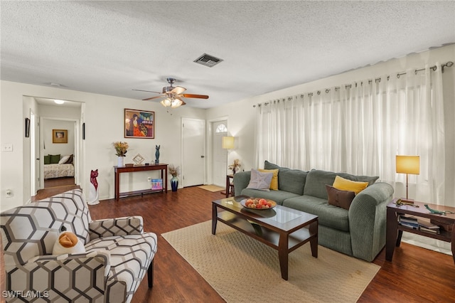 326 Canyon Dr N, Lehigh Acres, FL 33936 - living room with a textured ceiling, wood finished floors, and ceiling fan