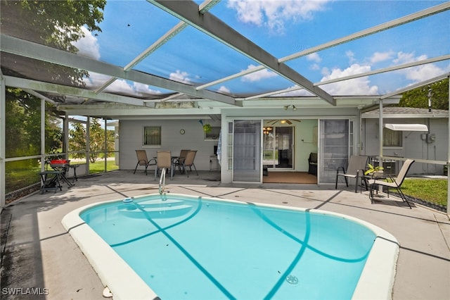 326 Canyon Dr N, Lehigh Acres, FL 33936 - outdoor pool featuring a patio and glass enclosure