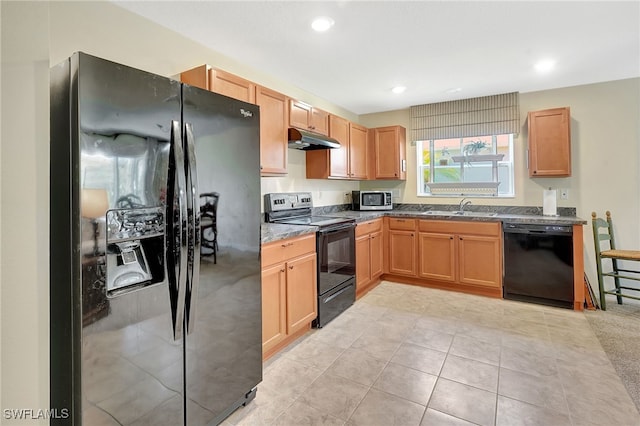 6425 Estero Bay Dr, Fort Myers, FL 33908 - kitchen featuring black appliances, under cabinet range hood, recessed lighting, light tile patterned floors, and dark stone counters