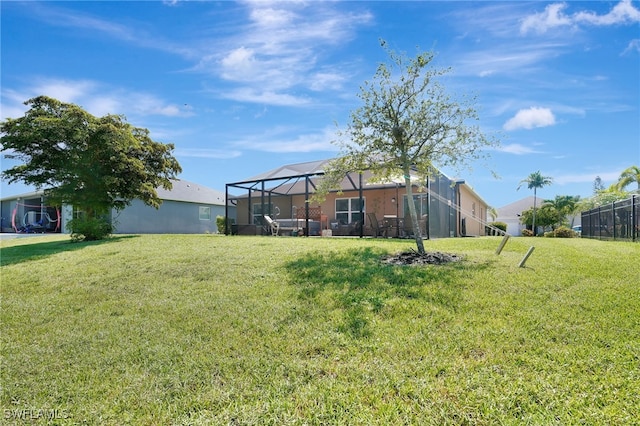 6425 Estero Bay Dr, Fort Myers, FL 33908 - view of grassy yard with glass enclosure