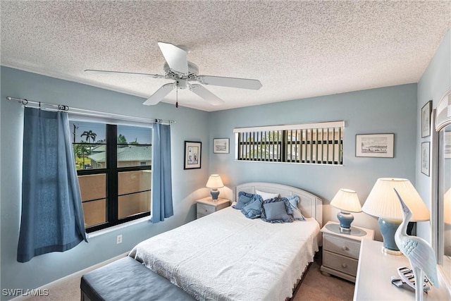 2127 SW Pine Ln Unit 3, Cape Coral, FL 33991 - bedroom with multiple windows, carpet, a textured ceiling, and a ceiling fan