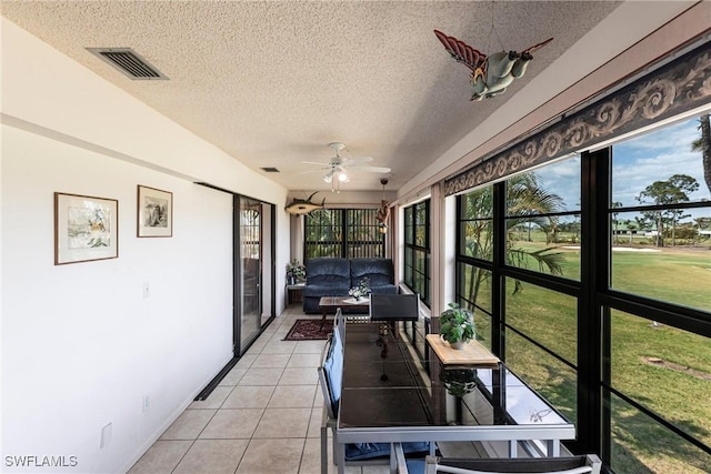 2127 SW Pine Ln Unit 3, Cape Coral, FL 33991 - sunroom / solarium featuring a ceiling fan, a textured ceiling, and tile patterned floors