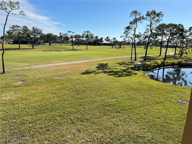 2127 SW Pine Ln Unit 3, Cape Coral, FL 33991 - view of property's community with a lawn, a water view, and golf course view