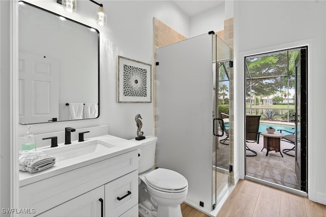 7637 Mulberry Ln, Naples, FL 34114 - full bath featuring vanity, a stall shower, and wood finished floors