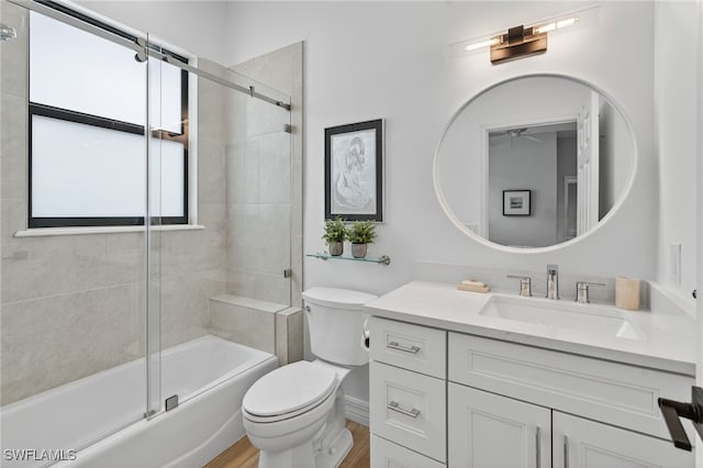 7637 Mulberry Ln, Naples, FL 34114 - bathroom with vanity, bath / shower combo with glass door, and wood finished floors