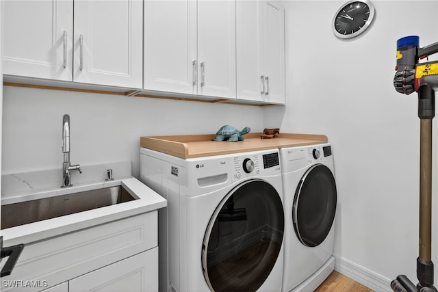 7637 Mulberry Ln, Naples, FL 34114 - laundry room with separate washer and dryer and cabinet space