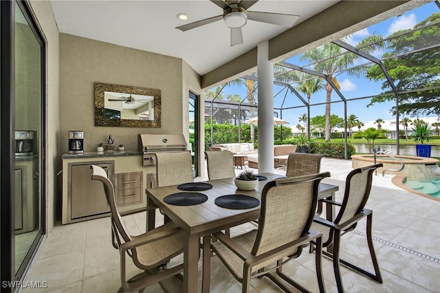7637 Mulberry Ln, Naples, FL 34114 - view of patio / terrace with exterior kitchen, ceiling fan, a water view, and outdoor dining space