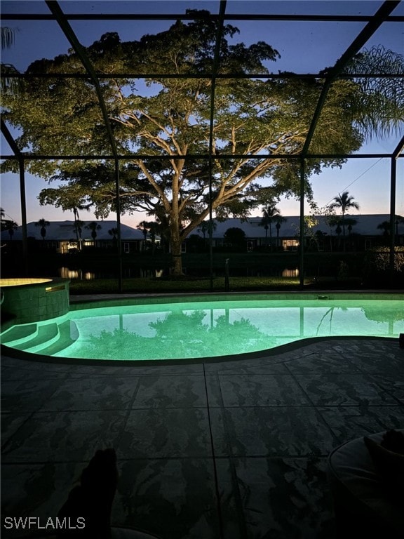 7637 Mulberry Ln, Naples, FL 34114 - outdoor pool featuring glass enclosure and a patio