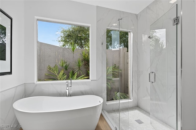 7637 Mulberry Ln, Naples, FL 34114 - full bathroom with a soaking tub and a marble finish shower