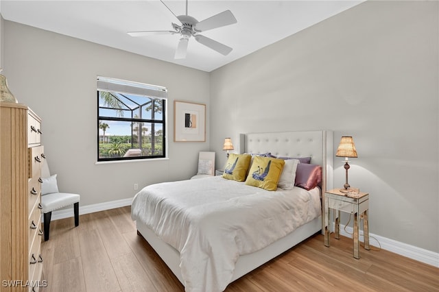 7637 Mulberry Ln, Naples, FL 34114 - bedroom featuring light wood finished floors and ceiling fan