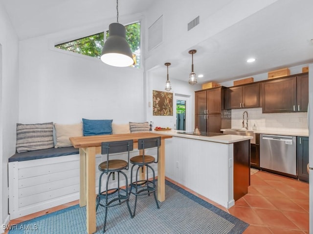 1271 Solana Rd Unit E4, Naples, FL 34103 - kitchen with dishwasher, breakfast area, healthy amount of natural light, black electric stovetop, and recessed lighting