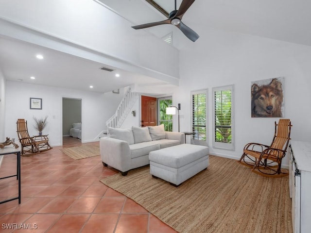 1271 Solana Rd Unit E4, Naples, FL 34103 - living room with light tile patterned floors, stairs, recessed lighting, ceiling fan, and a towering ceiling