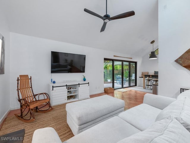 1271 Solana Rd Unit E4, Naples, FL 34103 - living room featuring a ceiling fan, high vaulted ceiling, and tile patterned floors