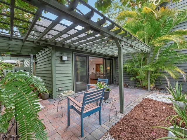 1271 Solana Rd Unit E4, Naples, FL 34103 - view of patio / terrace featuring a pergola