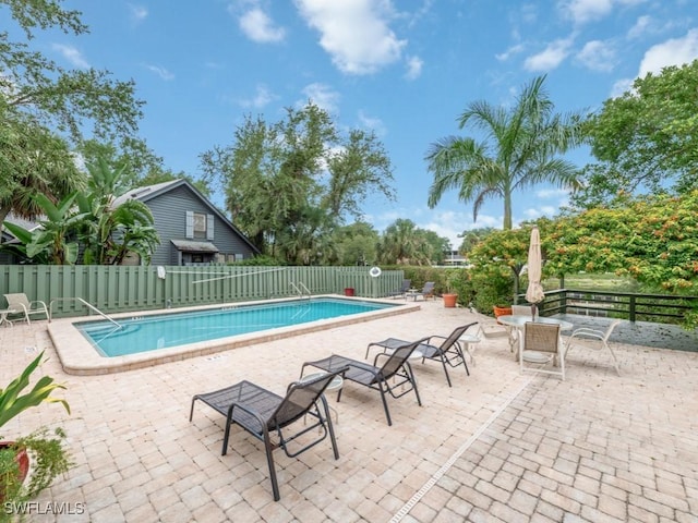 1271 Solana Rd Unit E4, Naples, FL 34103 - community pool featuring a patio