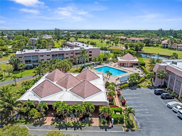 170 Turtle Lake Ct Unit 109, Naples, FL 34105 - drone / aerial view of a pool and a large body of water