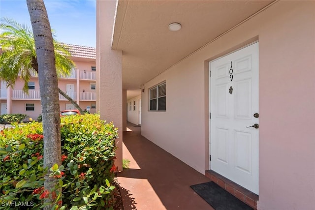 170 Turtle Lake Ct Unit 109, Naples, FL 34105 - view of exterior entry with stucco siding
