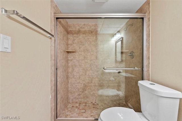 170 Turtle Lake Ct Unit 109, Naples, FL 34105 - bathroom featuring toilet and a stall shower