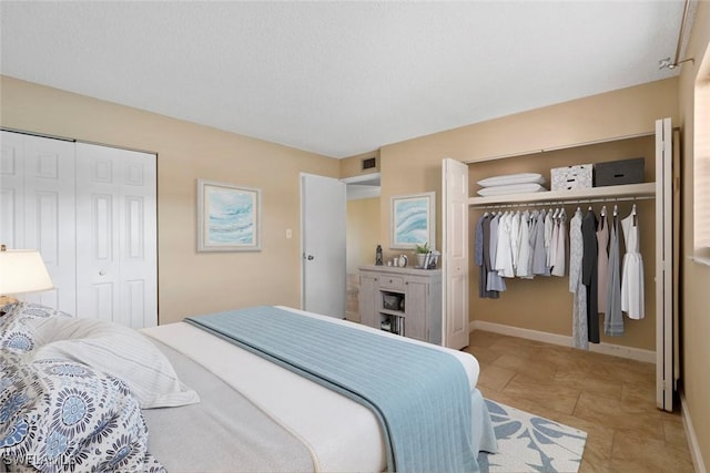 170 Turtle Lake Ct Unit 109, Naples, FL 34105 - bedroom featuring a closet and light tile patterned floors