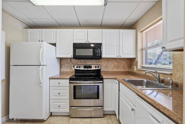 170 Turtle Lake Ct Unit 109, Naples, FL 34105 - kitchen featuring white appliances, white cabinetry, a drop ceiling, light tile patterned floors, and decorative backsplash