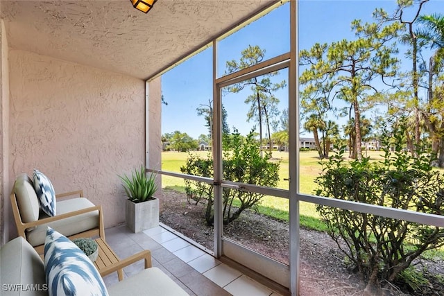 170 Turtle Lake Ct Unit 109, Naples, FL 34105 - sunroom / solarium featuring lofted ceiling