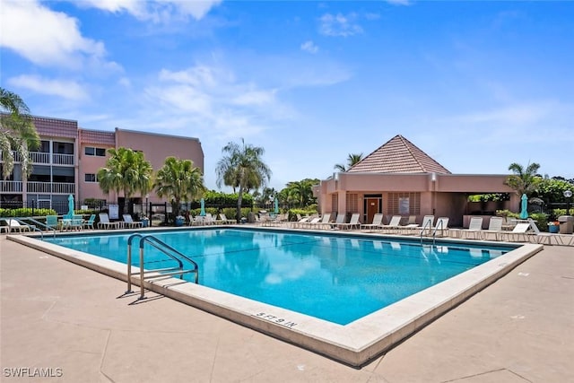 170 Turtle Lake Ct Unit 109, Naples, FL 34105 - community pool featuring a patio area