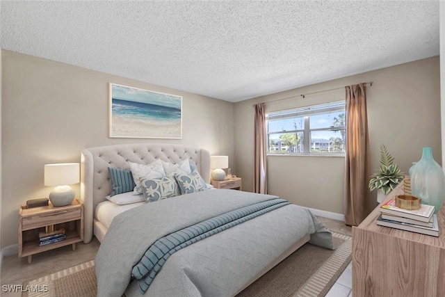 170 Turtle Lake Ct Unit 109, Naples, FL 34105 - bedroom with a textured ceiling and baseboards