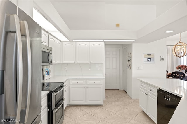 3615 Tripoli Blvd, Punta Gorda, FL 33950 - kitchen with stainless steel appliances, a chandelier, white cabinets, and light tile patterned flooring