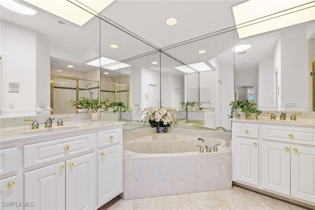 3615 Tripoli Blvd, Punta Gorda, FL 33950 - full bathroom with a bath, a shower stall, two vanities, recessed lighting, and tile patterned floors