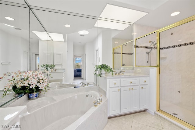 3615 Tripoli Blvd, Punta Gorda, FL 33950 - full bathroom with a garden tub, a stall shower, vanity, tile patterned flooring, and recessed lighting