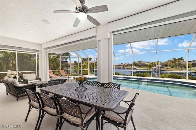 3615 Tripoli Blvd, Punta Gorda, FL 33950 - sunroom / solarium featuring a ceiling fan, an outdoor living space, a water view, and outdoor dining space